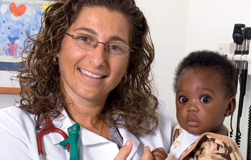 Dr. Cassandra Johnson with young patient