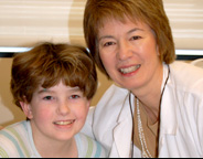 Lillian Meacham, MD, with pediatric cancer survivor