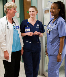 Kelly Brewer (left) holds a joint appointment with the School of Nursing and Emory Healthcare as DEU coordinator. She matches students like Ivey Milton (center) with seasoned staff nurses like Jackie Kandaya (right).