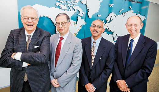 Richard Hubert (left) endowed the three global health professorships held by Carlos del Rio, Venkat Narayan, and Keith Klugman.