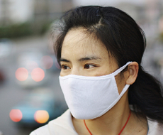 Chinese woman wearing a polution mask